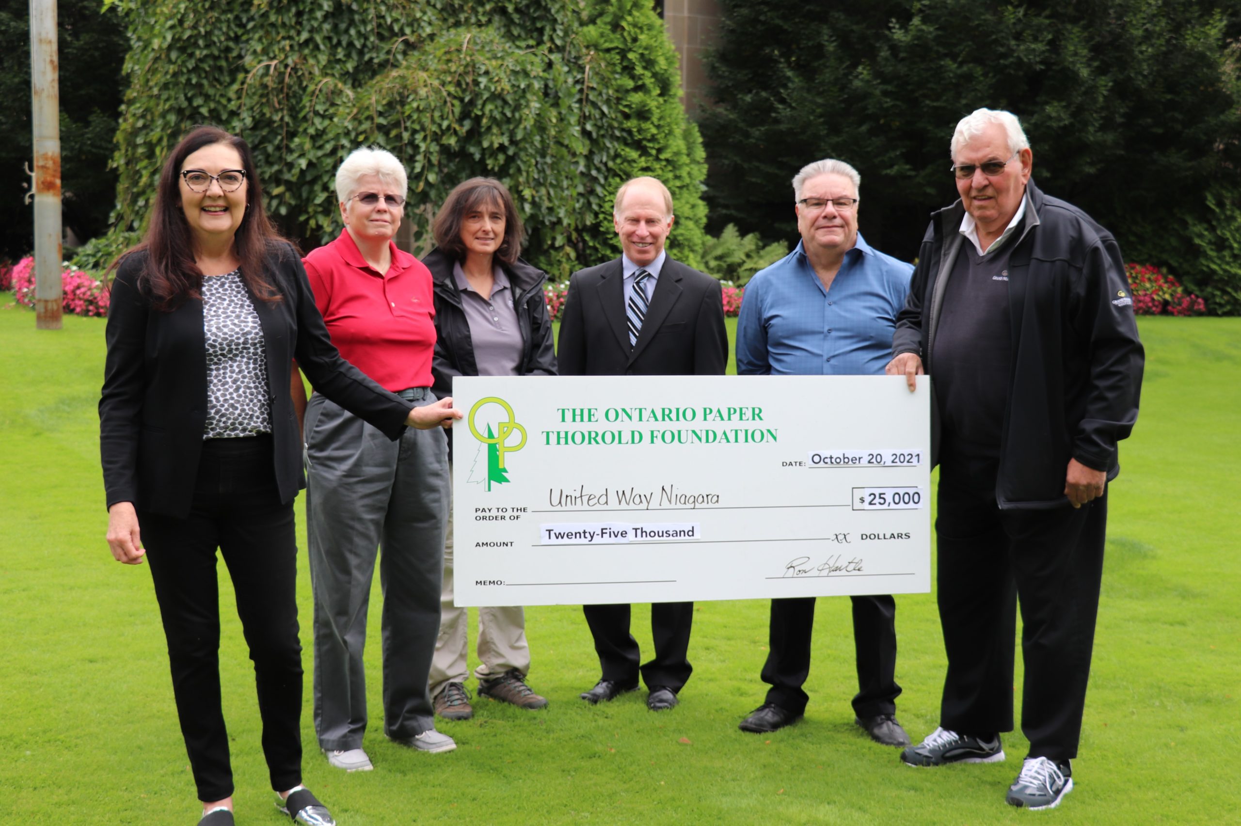 Ontario Thorold Paper Foundation member presenting $25000 check to United Way Niagara
