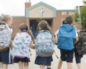 children walking to school with backpacks on