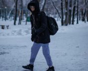 youth walking alone in the snow