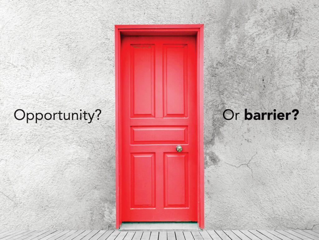 image of a red door on a faded gray concrete wall. Words say opportunity? or barrier?