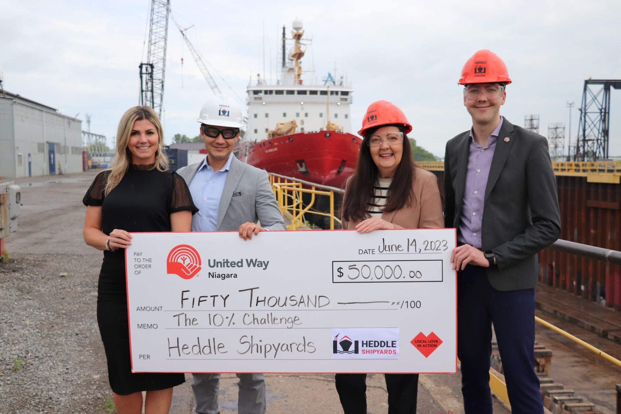 Dawn Thorp, Heddle Shipyards Public Relations & Communications Manager (L) and Shaun Padulo, Heddle Shipyards President & CEO present a $50,000 cheque to United Way's Frances Hallworth, CEO and Kevin Jong, Director of Development and Communications in support of the The Heddle Shipyards 10% Challenge.